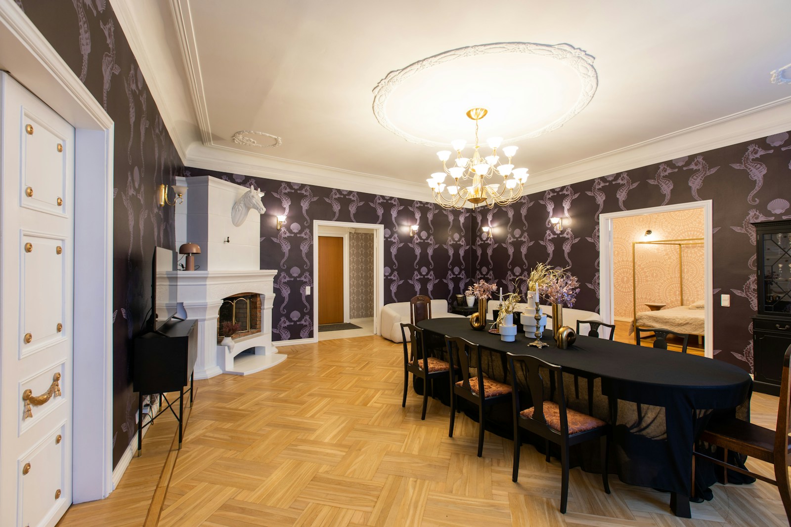 a dining room with a table and chairs